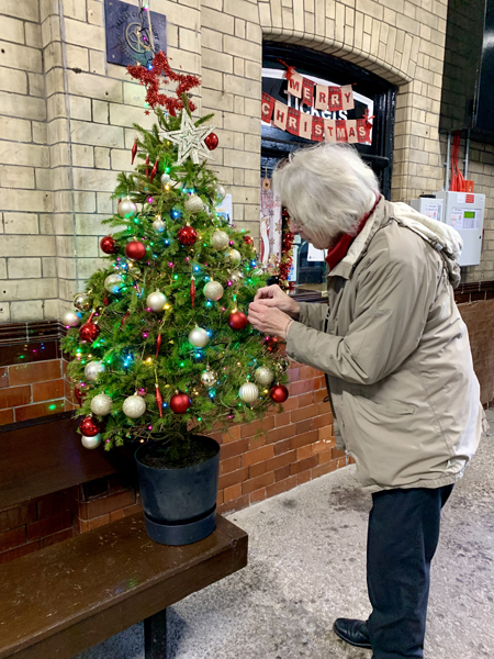 Diana puts the finishing touches to the tree